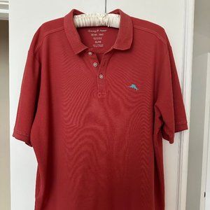 Tommy Bahama short sleeve polo shirt. Coral in color.